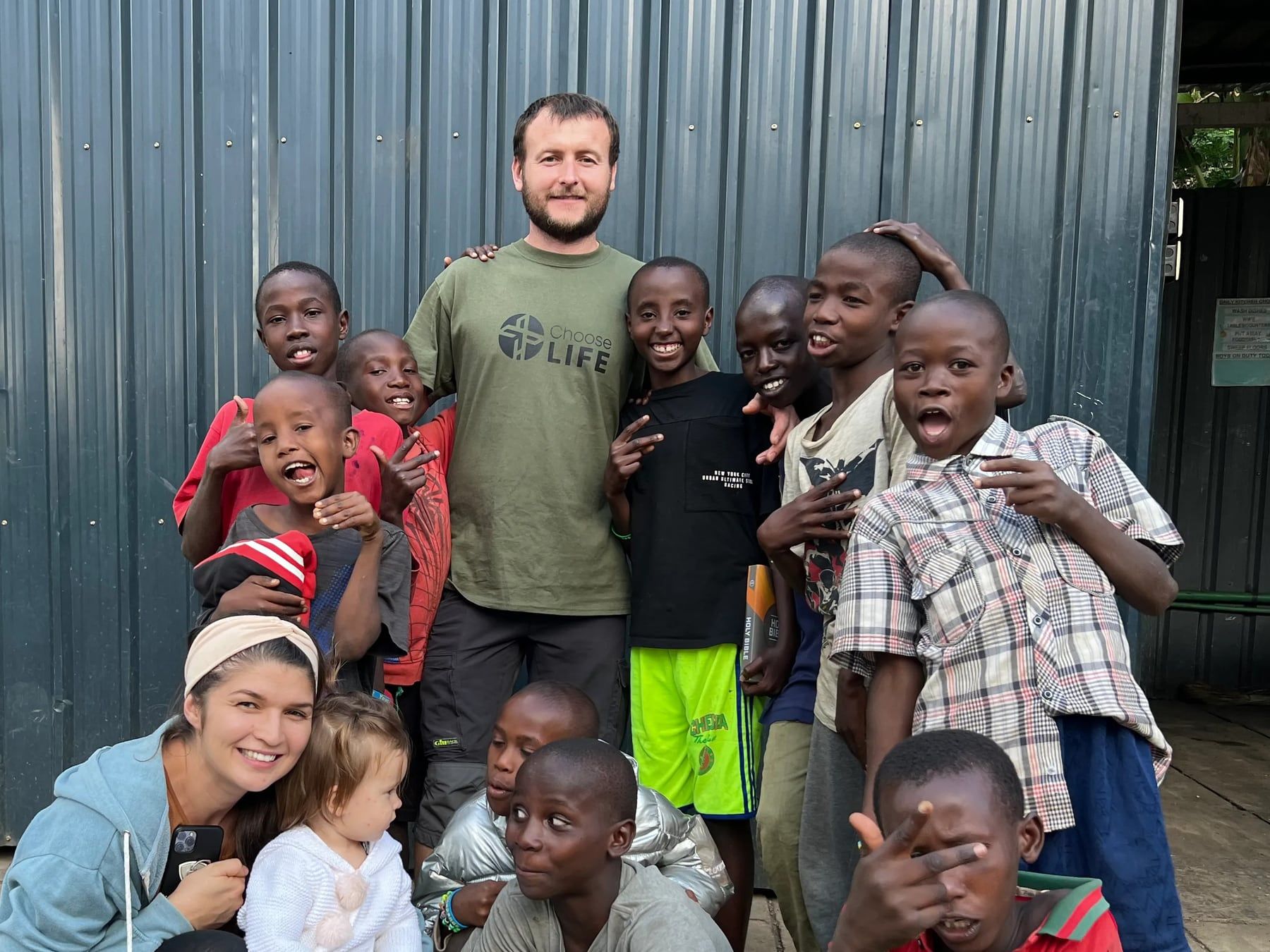 Embrace team members and boys gathered together at the centre