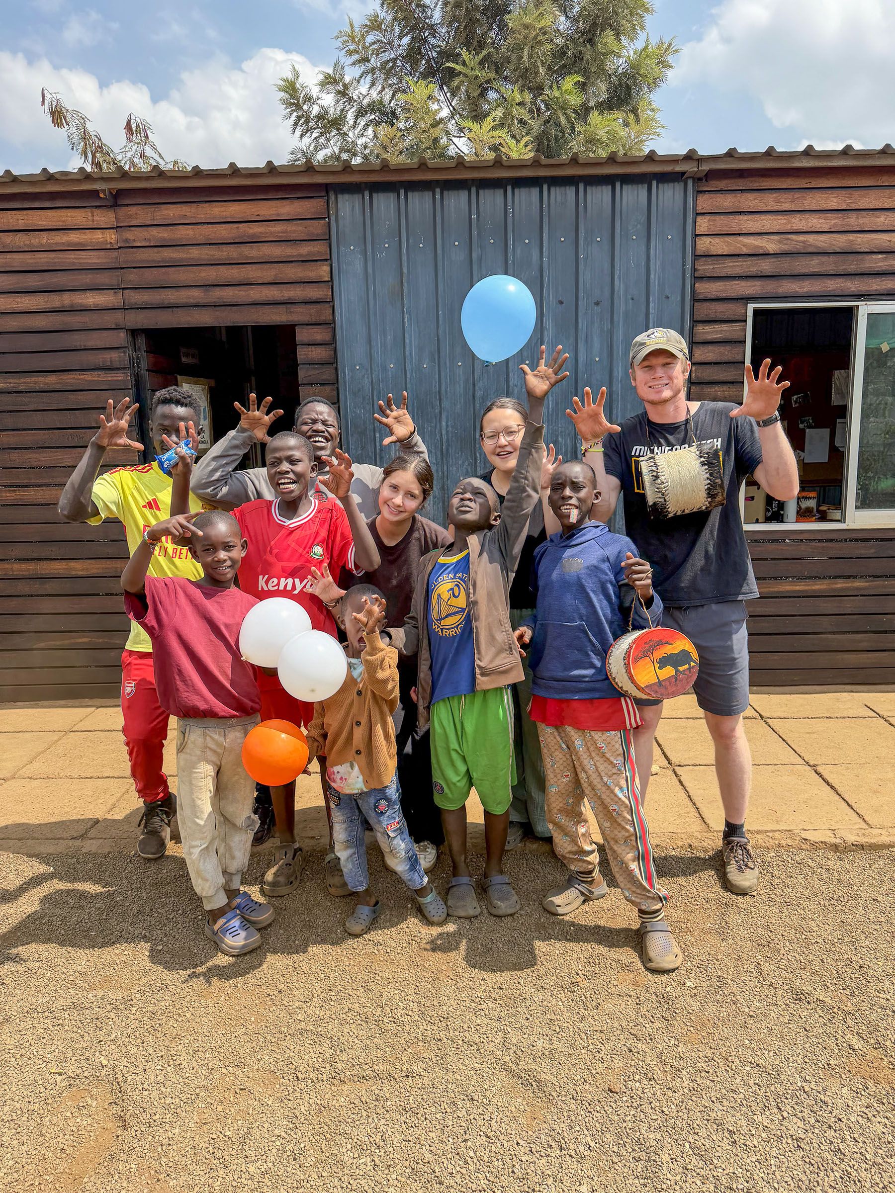 Embrace team members and boys gathered together at the centre