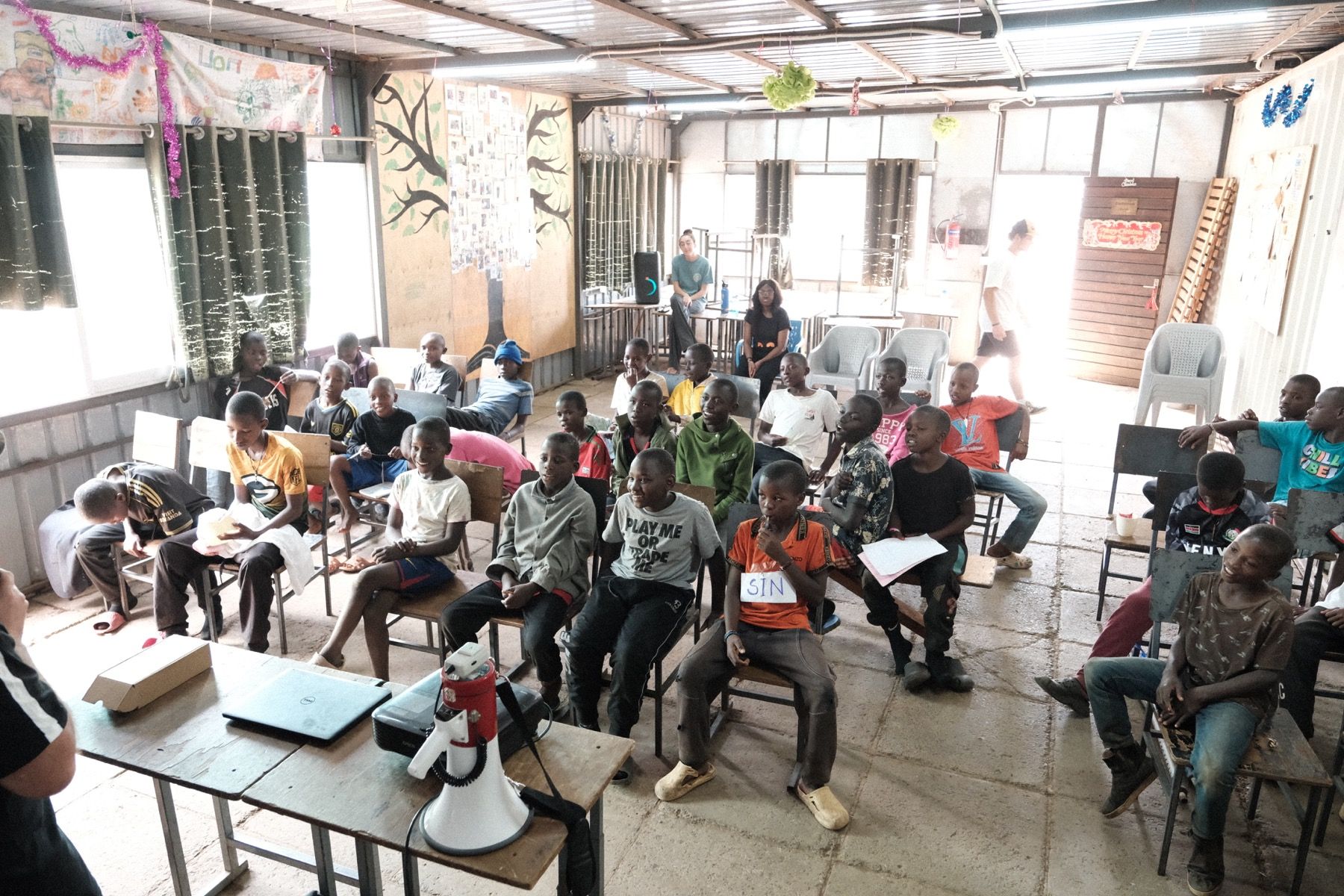 Boys seated for a group Bible lesson during Embrace Camp