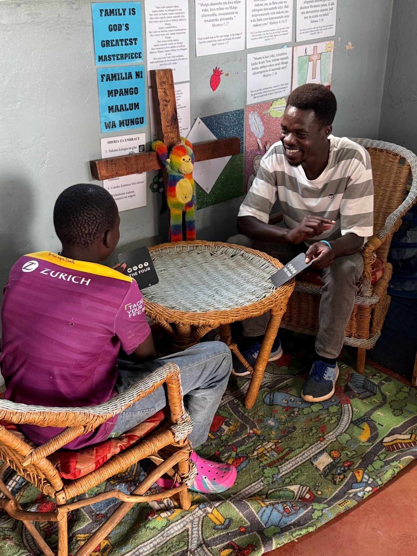 An Embrace staff member counselling a boy during a one-to-one Biblical counselling session