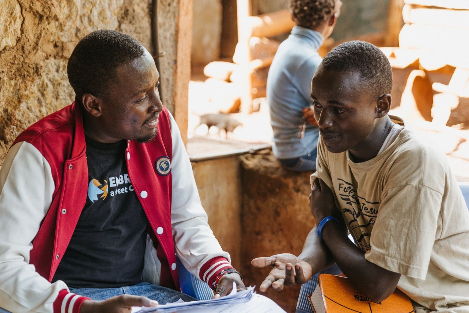 Jackson Mutugi speaking with an Embrace team member