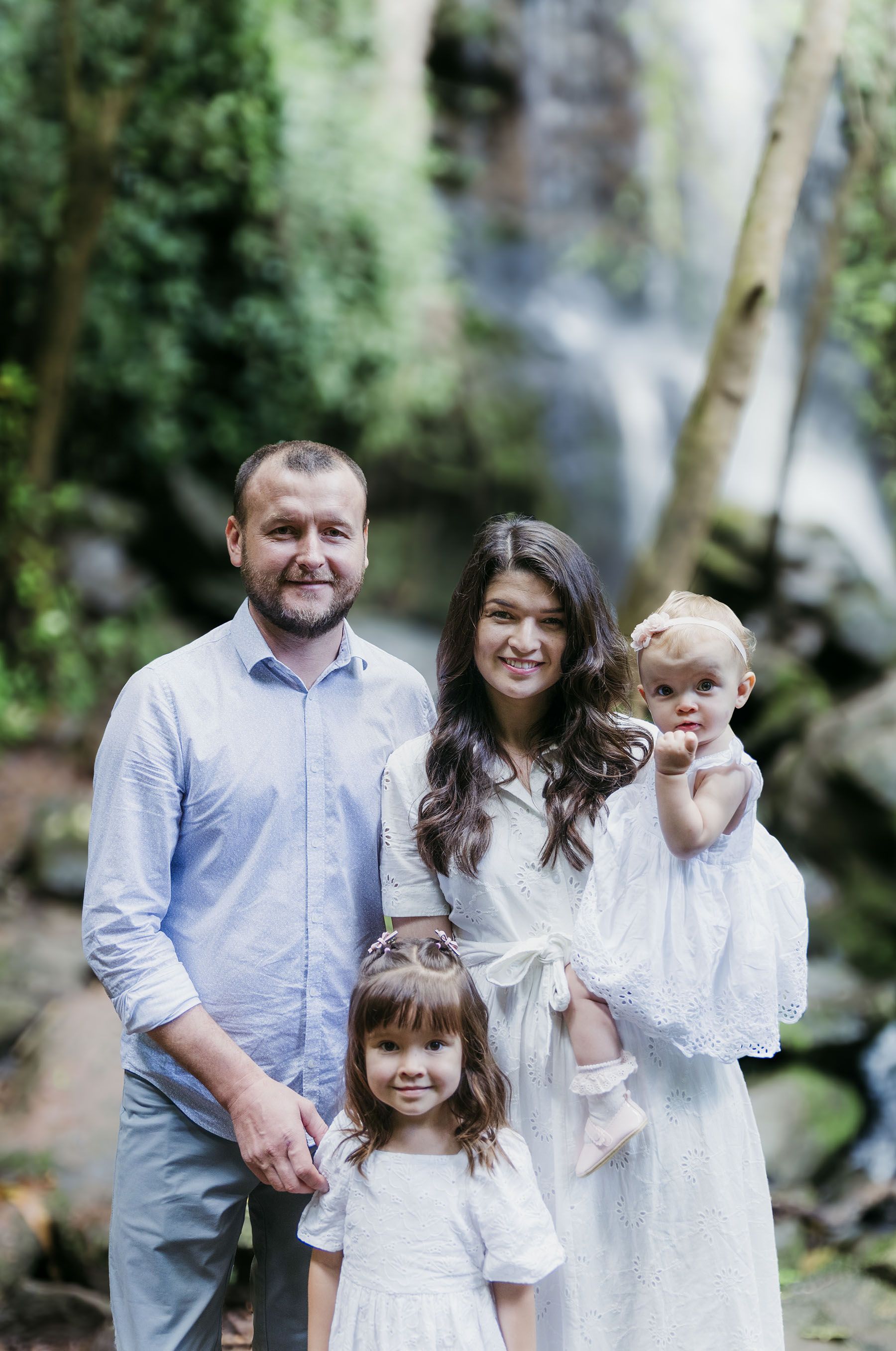John and Palina Sterenchuk with their children outdoors