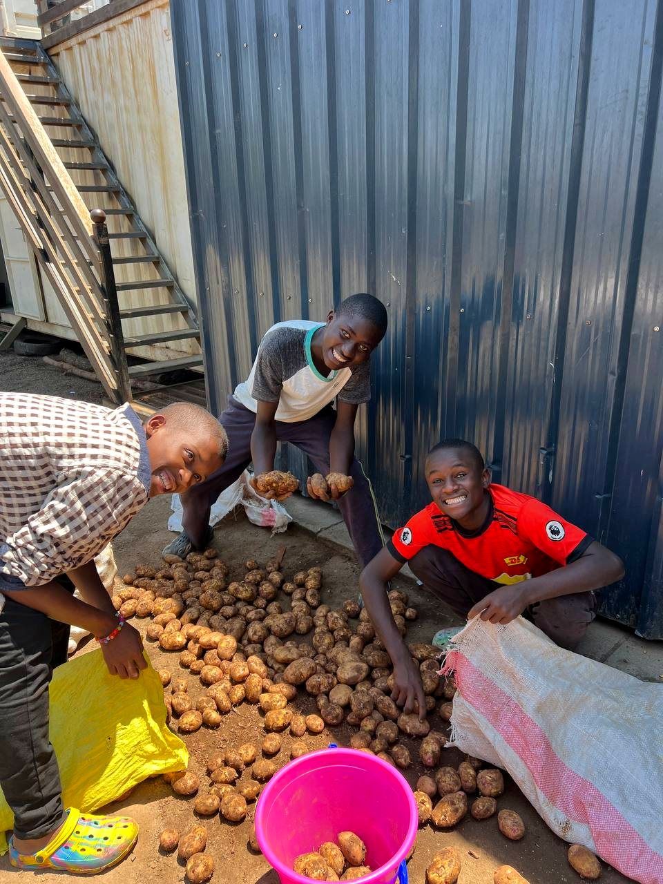 Boys helping with daily routines at an Embrace centre