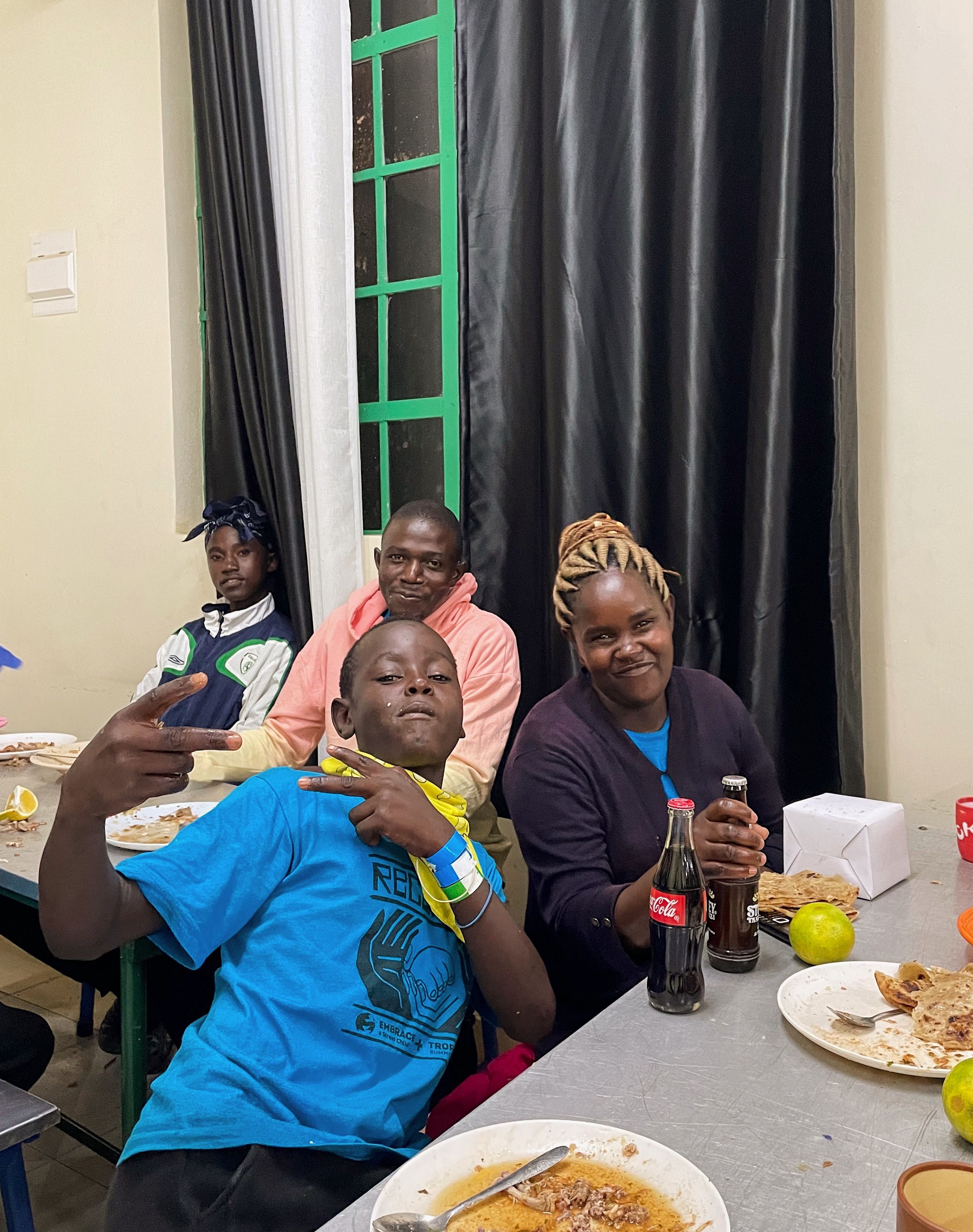 A family group sharing a meal and activity time during Reconnect Camp