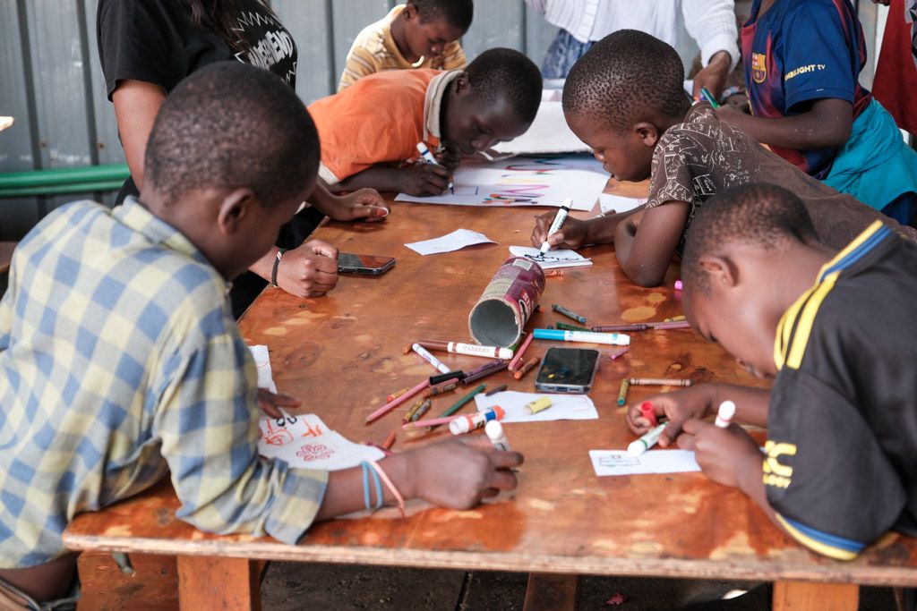 Boys learning practical carpentry skills at the centre